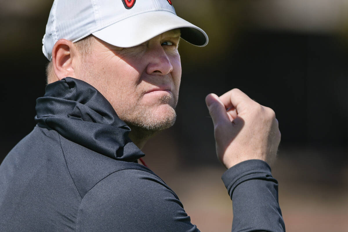 UNLV football head coach Barry Odom watches his team on the first day of practice Saturday, Mar ...