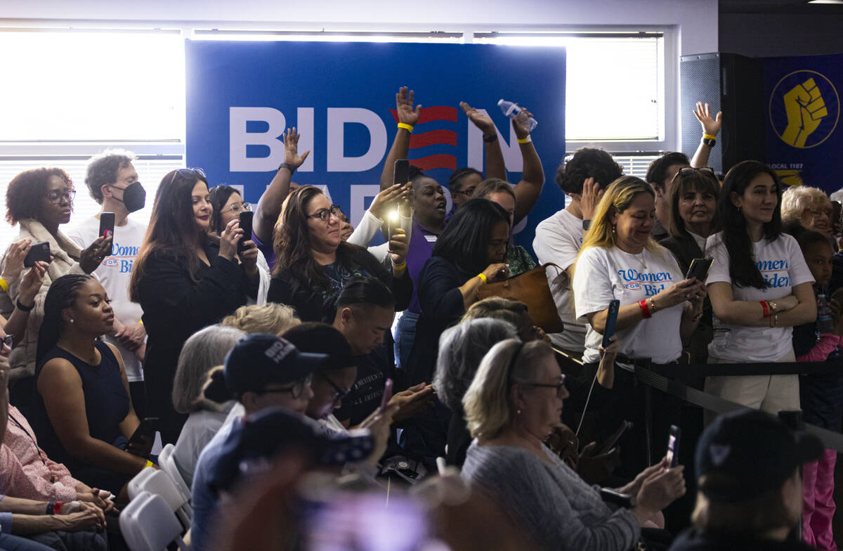 Attendees cheer during a campaign event to encourage women to vote with First lady Jill Biden, ...