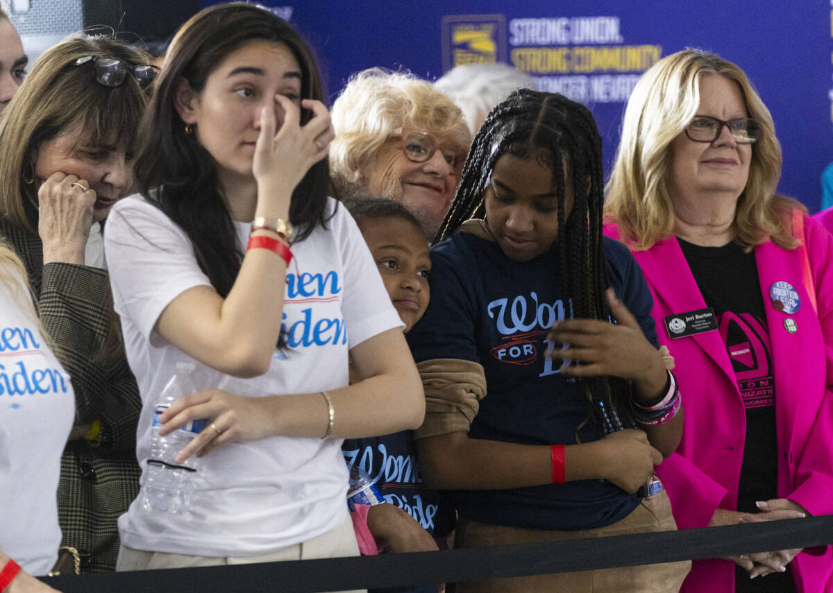 Attendees listen during a campaign event to encourage women to vote with First lady Jill Biden, ...
