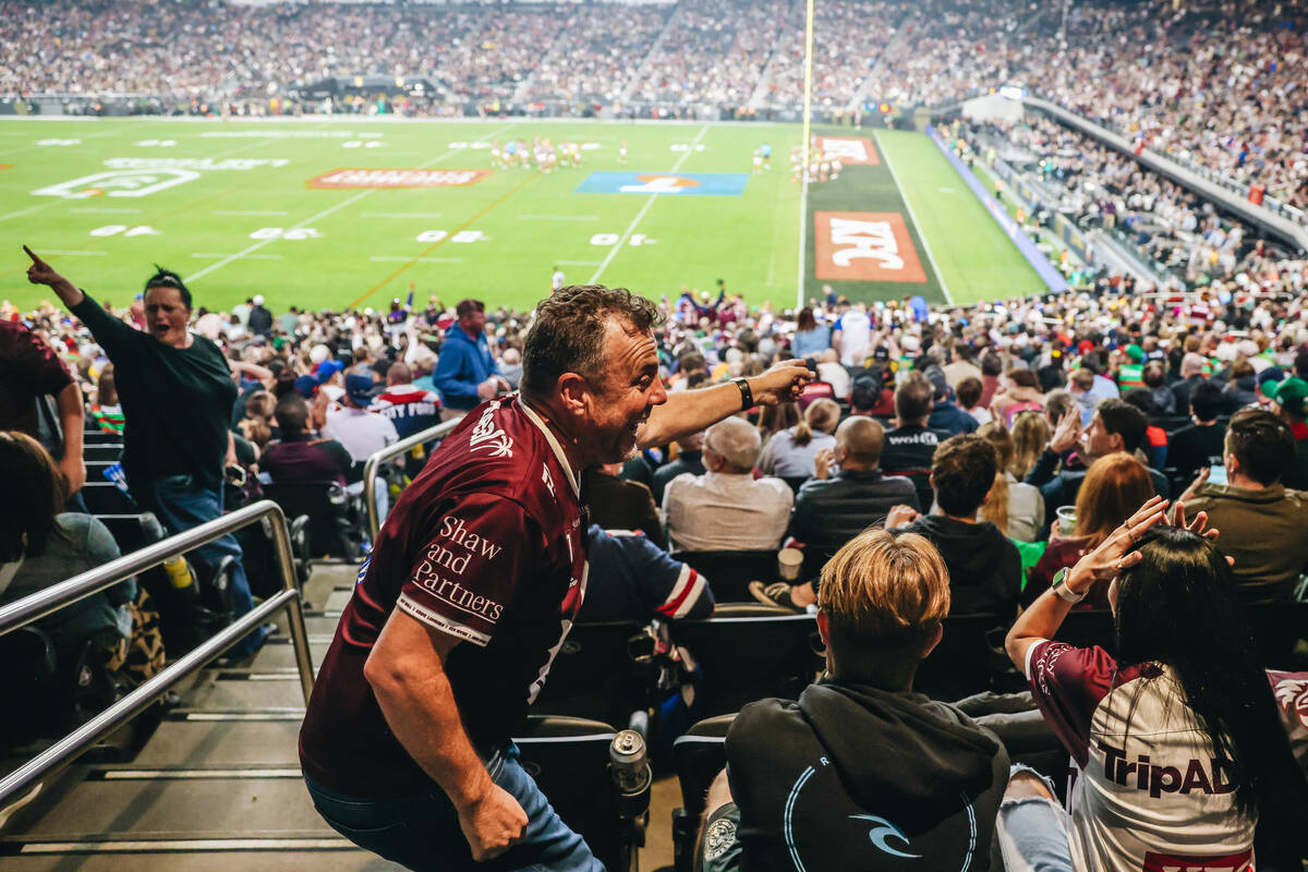 A Sea Eagles fan celebrates a try during a rugby match between the Sea Eagles and Rabbitohs at ...