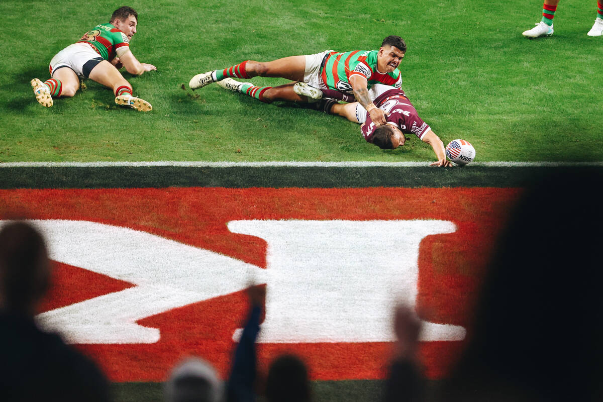 The Sea Eagles score a try as fans celebrate during a rugby match between the Sea Eagles and Ra ...