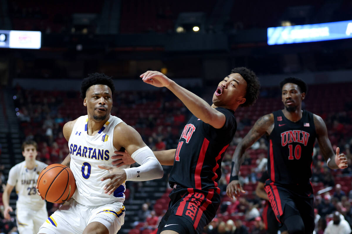 San Jose State Spartans guard Myron Amey Jr. (0) commits an offensive foul on UNLV Rebels guard ...