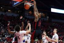 UNLV Rebels guard Luis Rodriguez (15) dunks on the San Jose State Spartans during the first hal ...