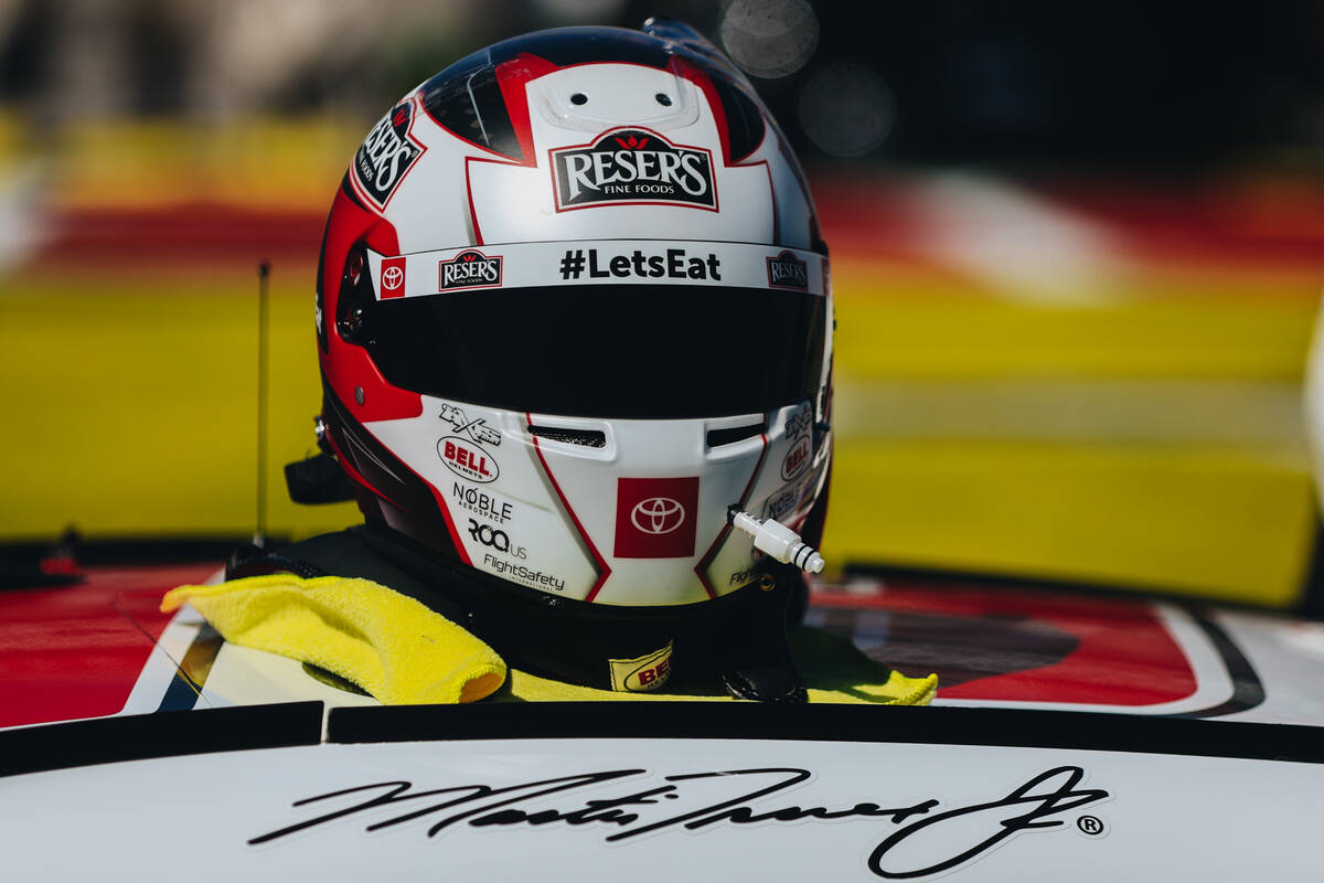 Racer Martin Truex Jr.’s helmet sits on top of his car at the Pennzoil 400 NASCAR Cup Se ...