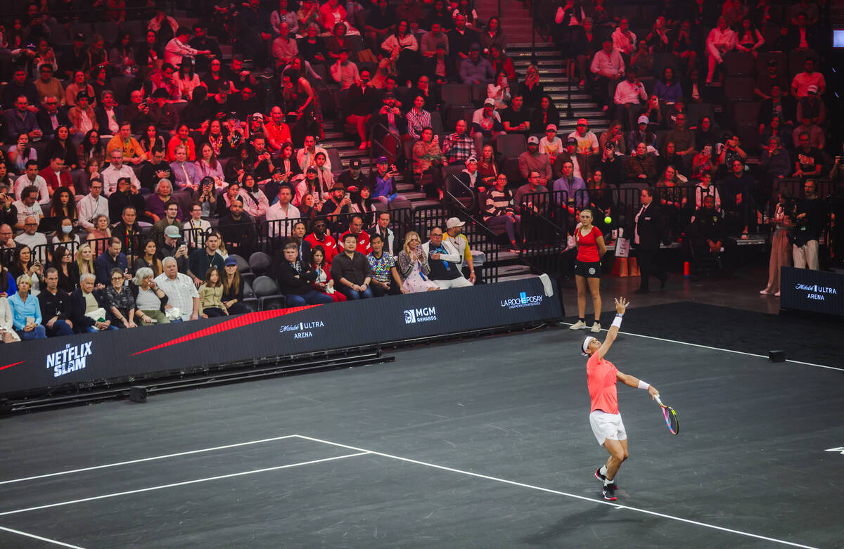 Rafael Nadal serves against Carlos Alcaraz at the Netflix Slam, at Michelob ULTRA Arena Mandala ...