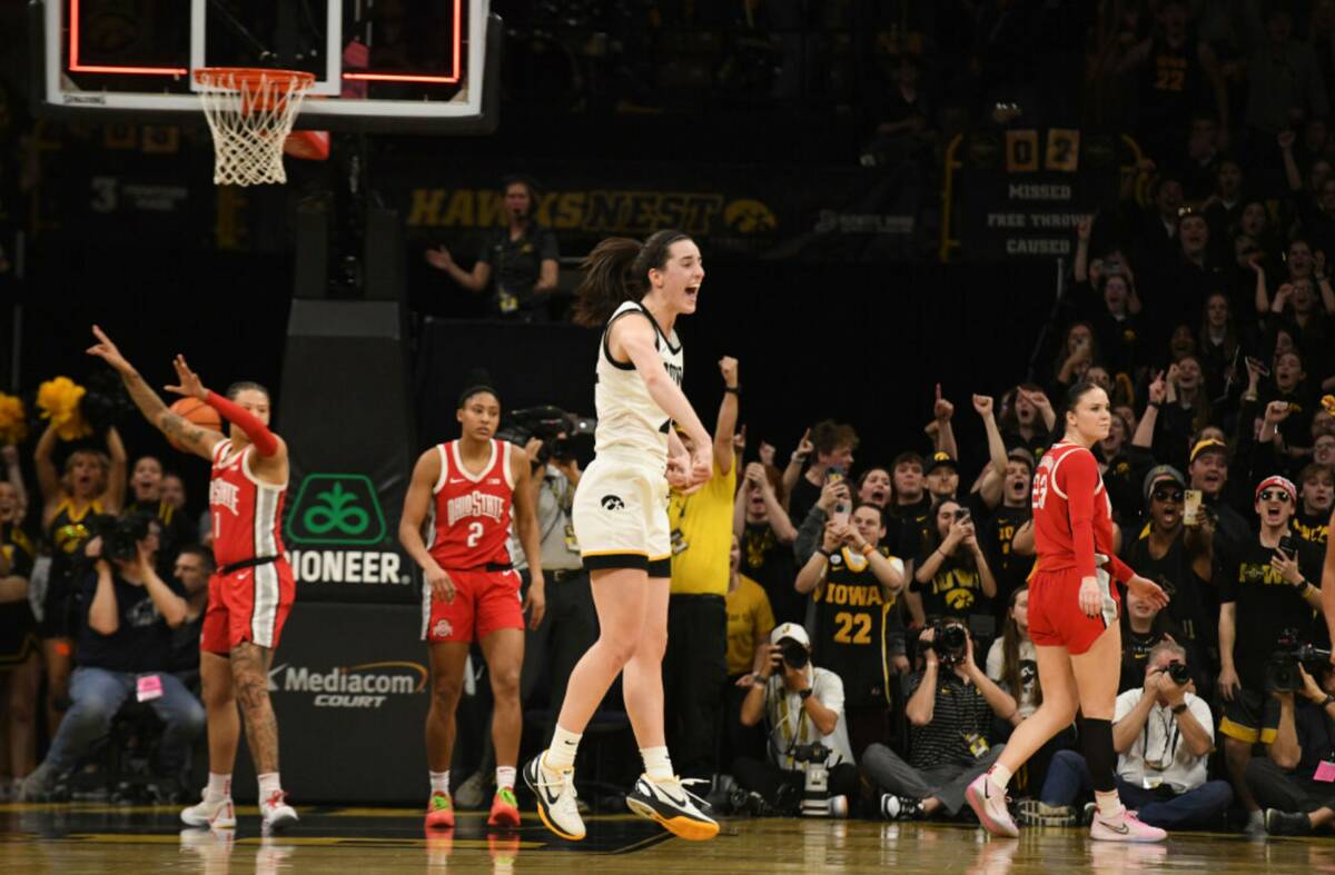 Iowa guard Caitlin Clark (22) celebrates after becoming the all-time leading scorer in NCAA Div ...