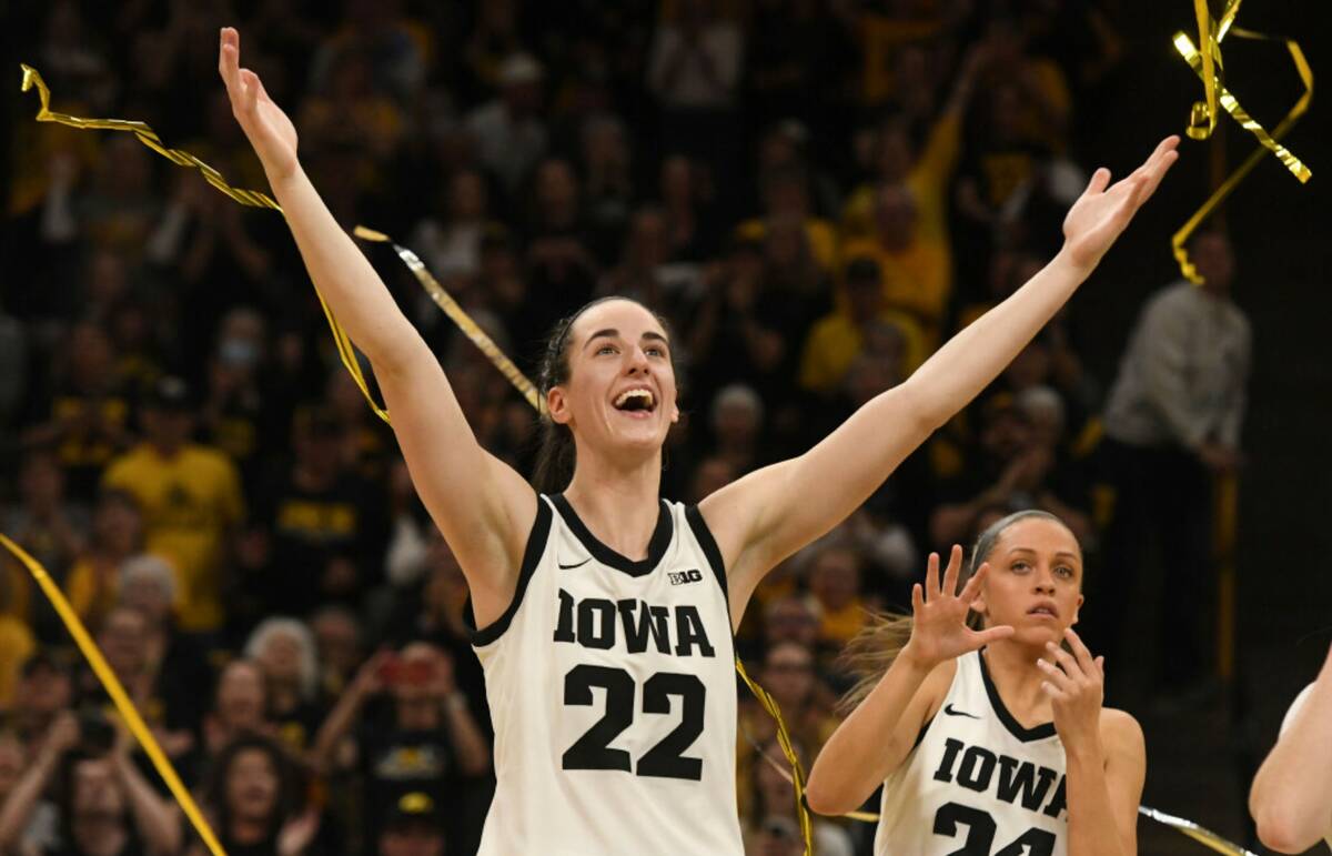 Iowa guard Caitlin Clark (22) celebrates during Senior Day ceremonies following a victory over ...