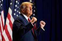 Republican presidential candidate former President Donald Trump gestures at a campaign rally Sa ...