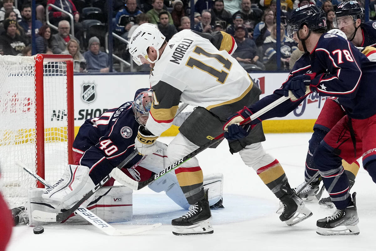 Vegas Golden Knights left wing Mason Morelli (11) shoots against Columbus Blue Jackets goaltend ...