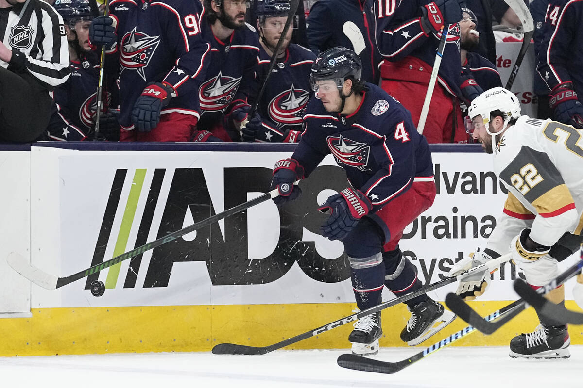 Columbus Blue Jackets center Cole Sillinger (4) carries the puck in front of Vegas Golden Knigh ...