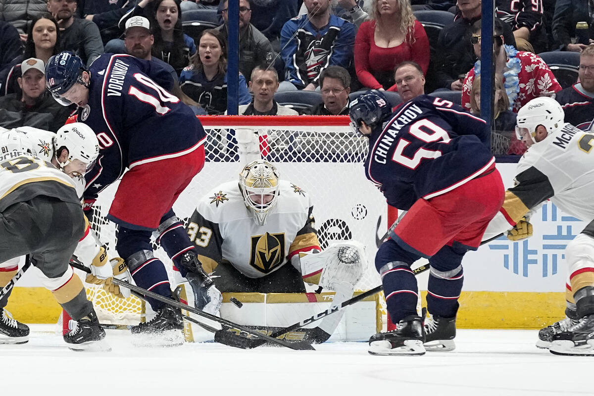 Vegas Golden Knights goaltender Adin Hill blocks a shot by Columbus Blue Jackets right wing Yeg ...