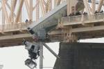 Firefighter: Rescue of truck driver dangling from bridge was team effort