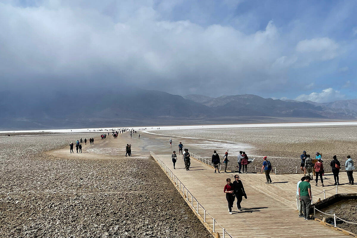 Visitors see what's left of Lake Manly at Badwater Basin in Death Valley National Park on March ...