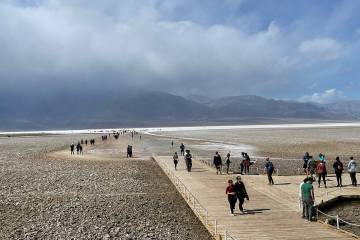 Visitors see what's left of Lake Manly at Badwater Basin in Death Valley National Park on March ...