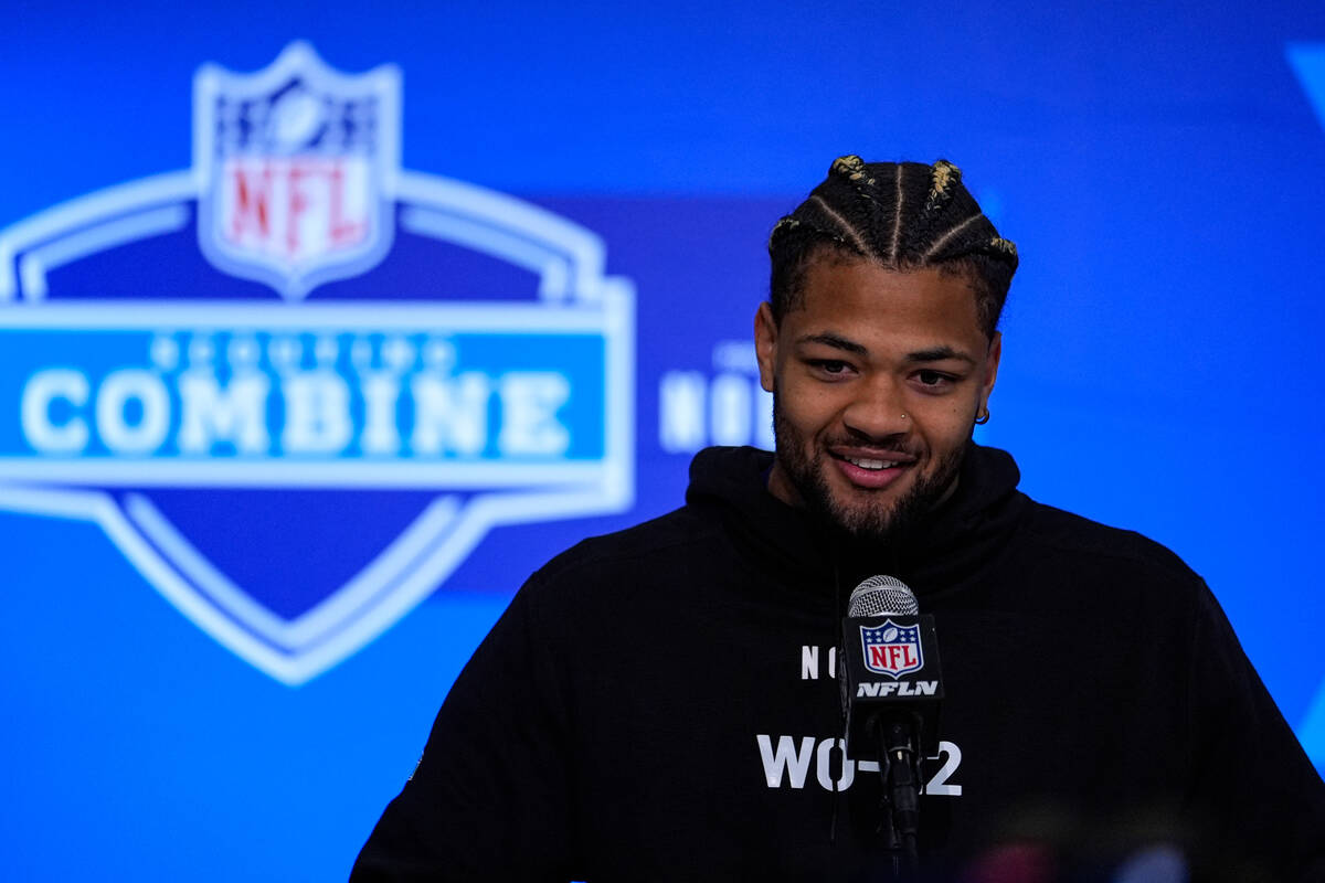 Washington wide receiver Rome Odunze speaks during a press conference at the NFL football scout ...