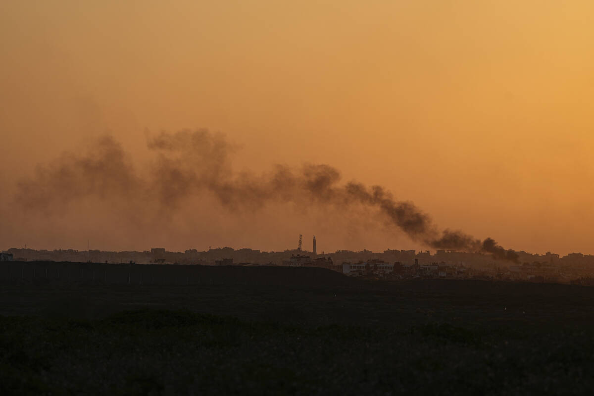 Smoke rises following an explosion in the Gaza Strip as seen from southern Israel, Monday, Marc ...