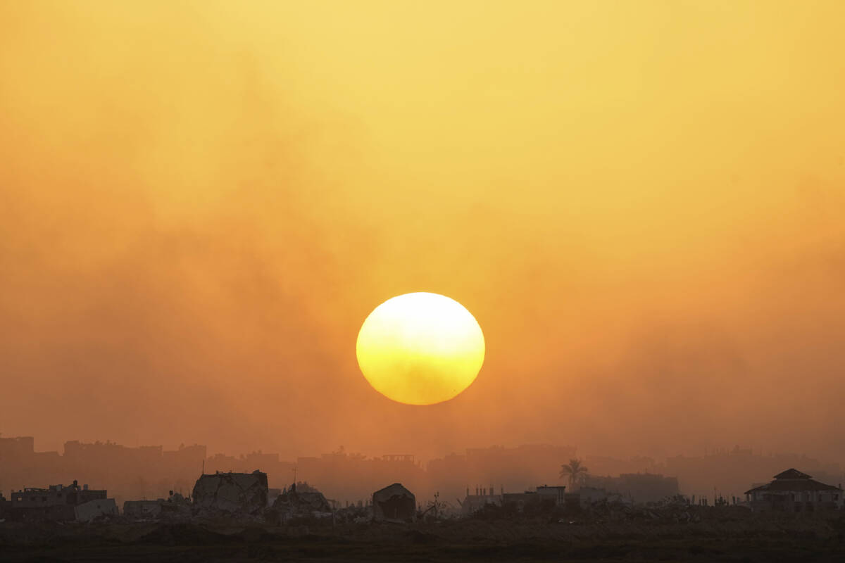 The sun sets over the Gaza Strip as seen from southern Israel, Monday, March 4, 2024. (AP Photo ...