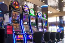 Slot machines are seen in the baggage area in Terminal 1 at Harry Reid International Airport. ( ...
