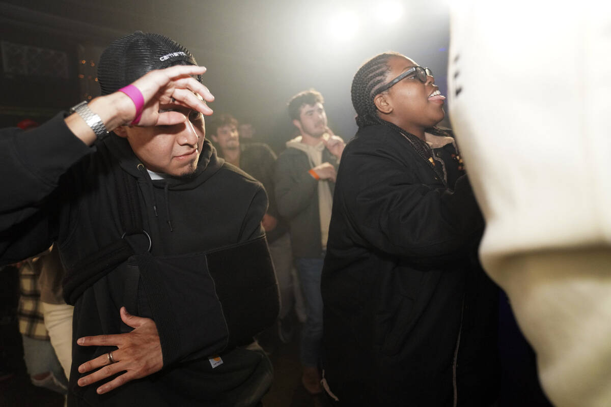 Attendees join in a dance line at The Cove, a pop-up, 18-and-up Christian nightclub, on Saturda ...