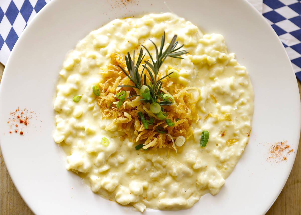Käsespätzle, a very special German noodle dish with Swiss cheese and crisp onions, is display ...