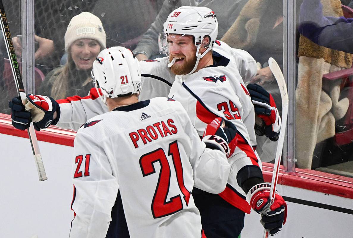 Washington Capitals' Anthony Mantha (39) celebrates with Aliaksei Protas after scoring against ...