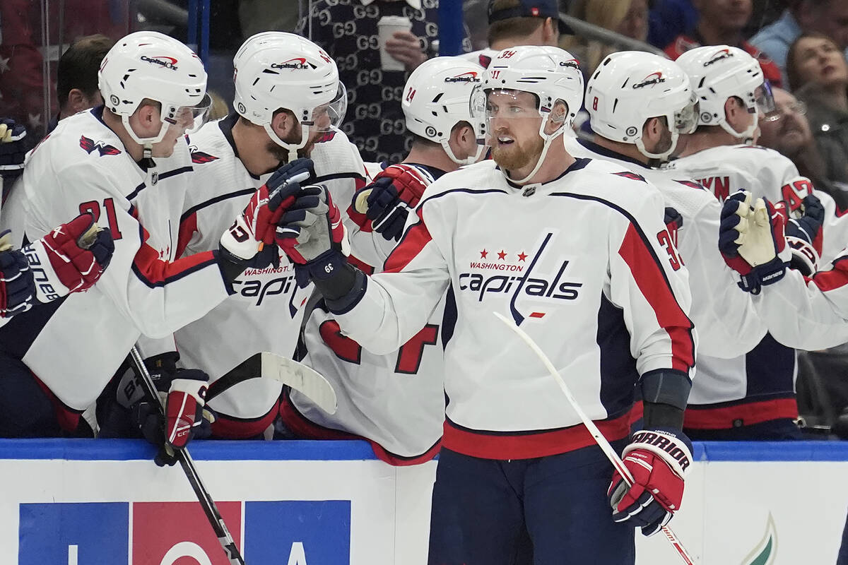 Washington Capitals right wing Anthony Mantha (39) celebrates with the bench after his goal aga ...
