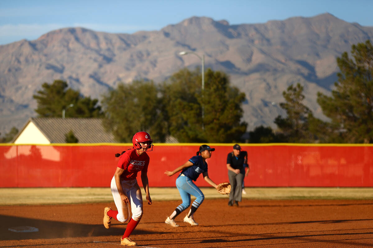 Arbor View’s Madilyn Lowy runs for home plate while Centennial looks to end the play dur ...