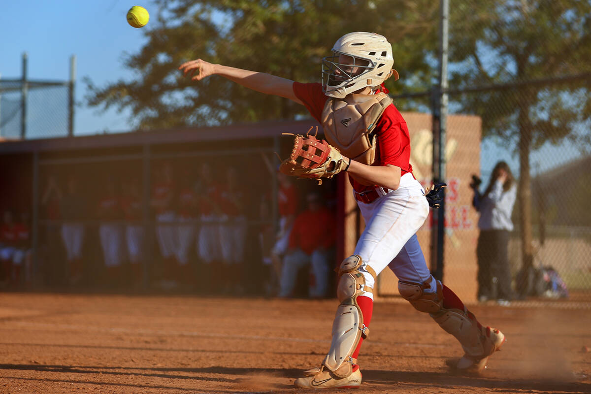 Arbor View catcher Kelsie Phares (39) throws to third base during a high school softball game a ...