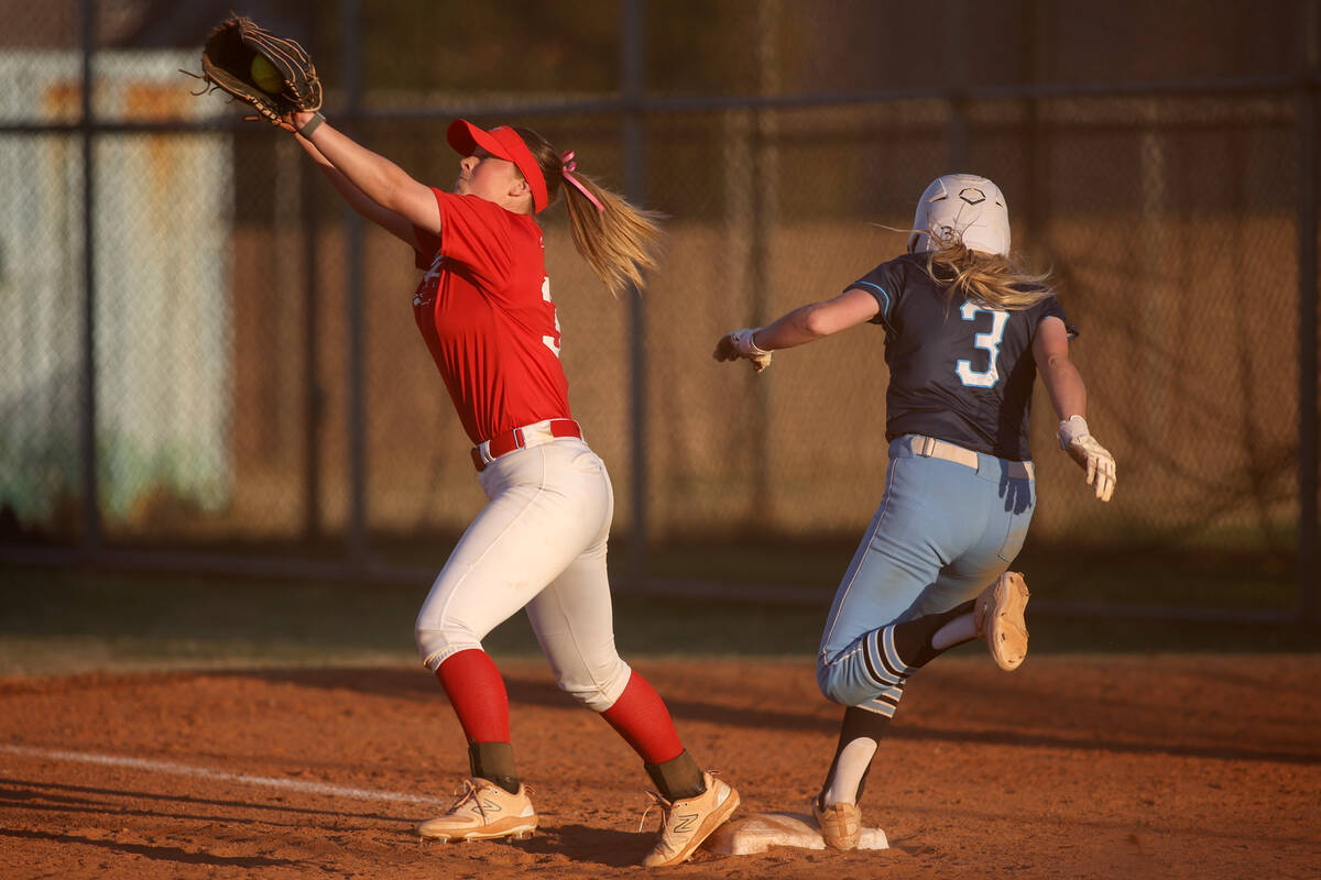 Arbor View first baseman Merynlie Westwood catches for an out against Centennial's Ashley Madon ...