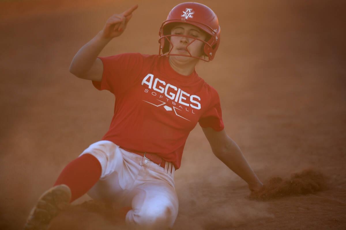 Arbor View short stop Madilyn Lowy slides into third base during a high school softball game ag ...