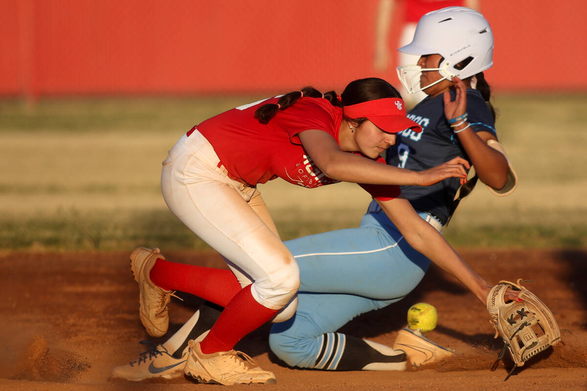 Arbor View shortstop Madilyn Lowy collides with Centennial's Hailey Smith (9) during a high sch ...