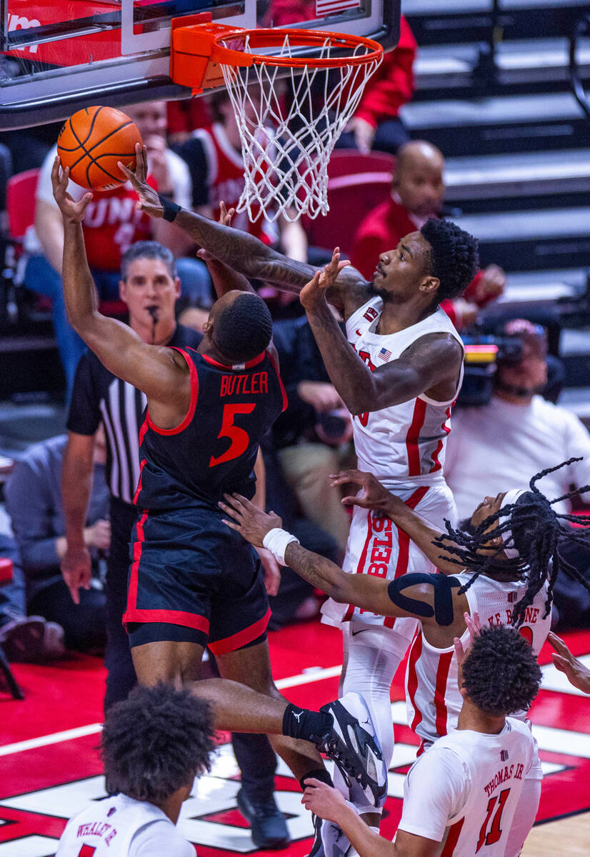 UNLV forward Kalib Boone (10) rejects a shot by San Diego State Aztecs guard Lamont Butler (5) ...
