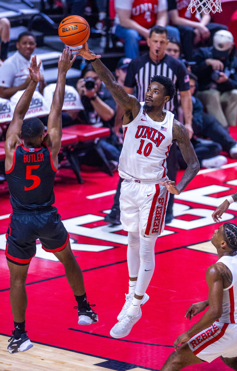 UNLV forward Kalib Boone (10) rejects a shot by San Diego State Aztecs guard Lamont Butler (5) ...