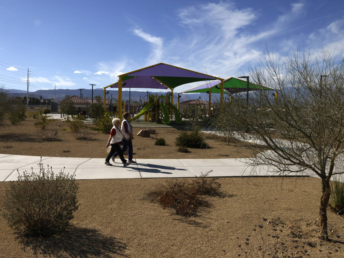 People walk at Echo Trail Park, on Tuesday, March 5, 2024, in Las Vegas. County commissioners a ...