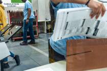 Workers continue sorting ballots for final tabulations at the Clark County Election Department ...