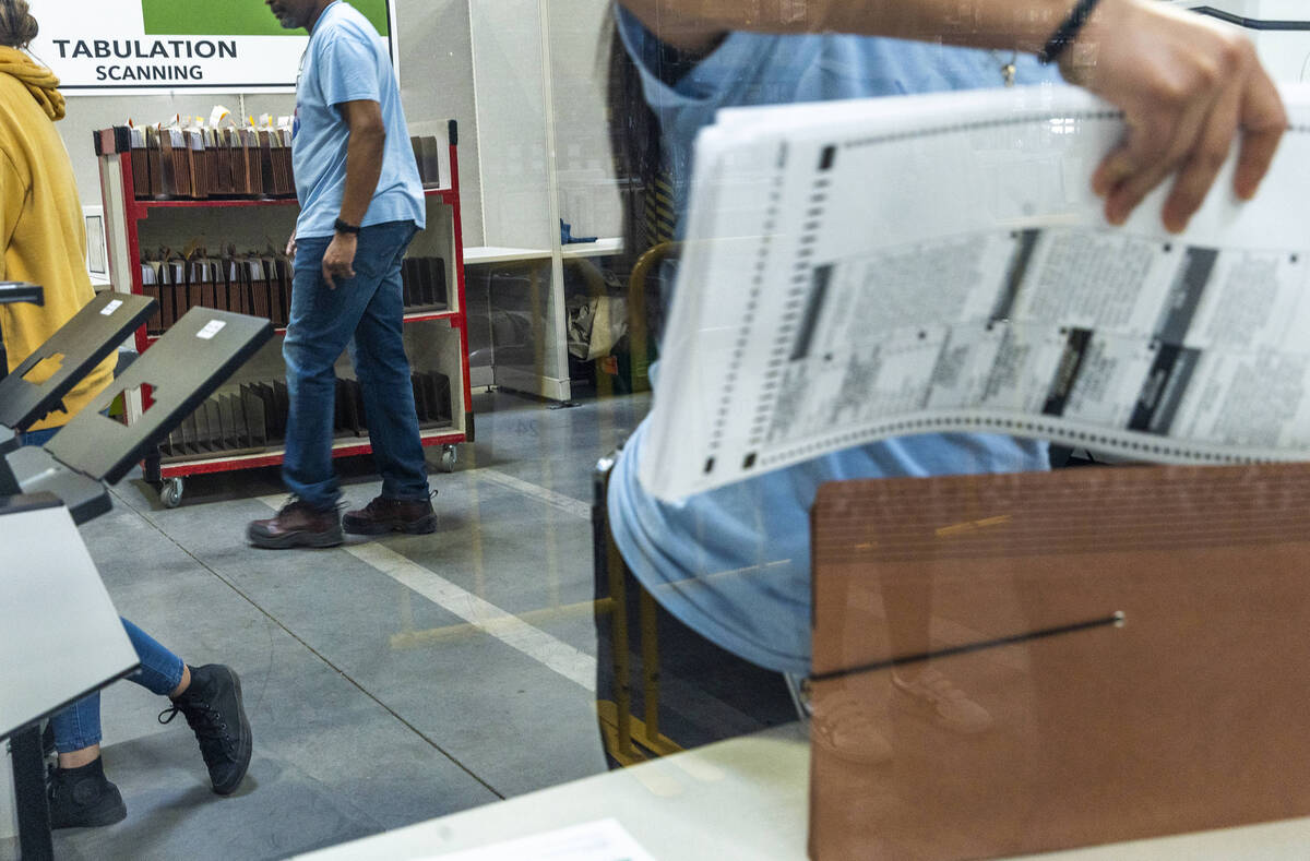 Workers continue sorting ballots for final tabulations at the Clark County Election Department ...