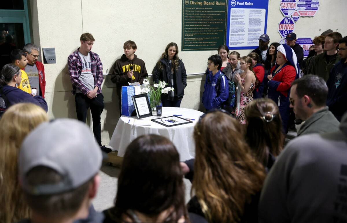 Teammates from throughout Charlie Clark’s swim career speak during a vigil for the 19-year-ol ...