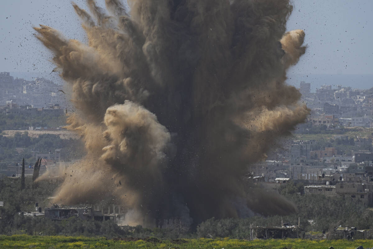 Smoke and debris rise following an explosion in the Gaza Strip as seen from southern Israel, We ...