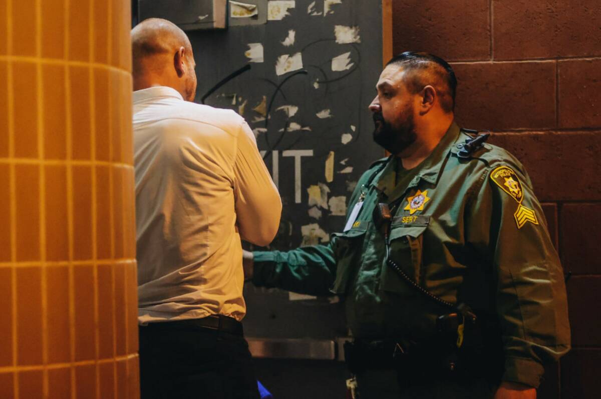 Daniel Rodimer, left, speaks to an officer after bonding out of jail at the Clark County Detent ...