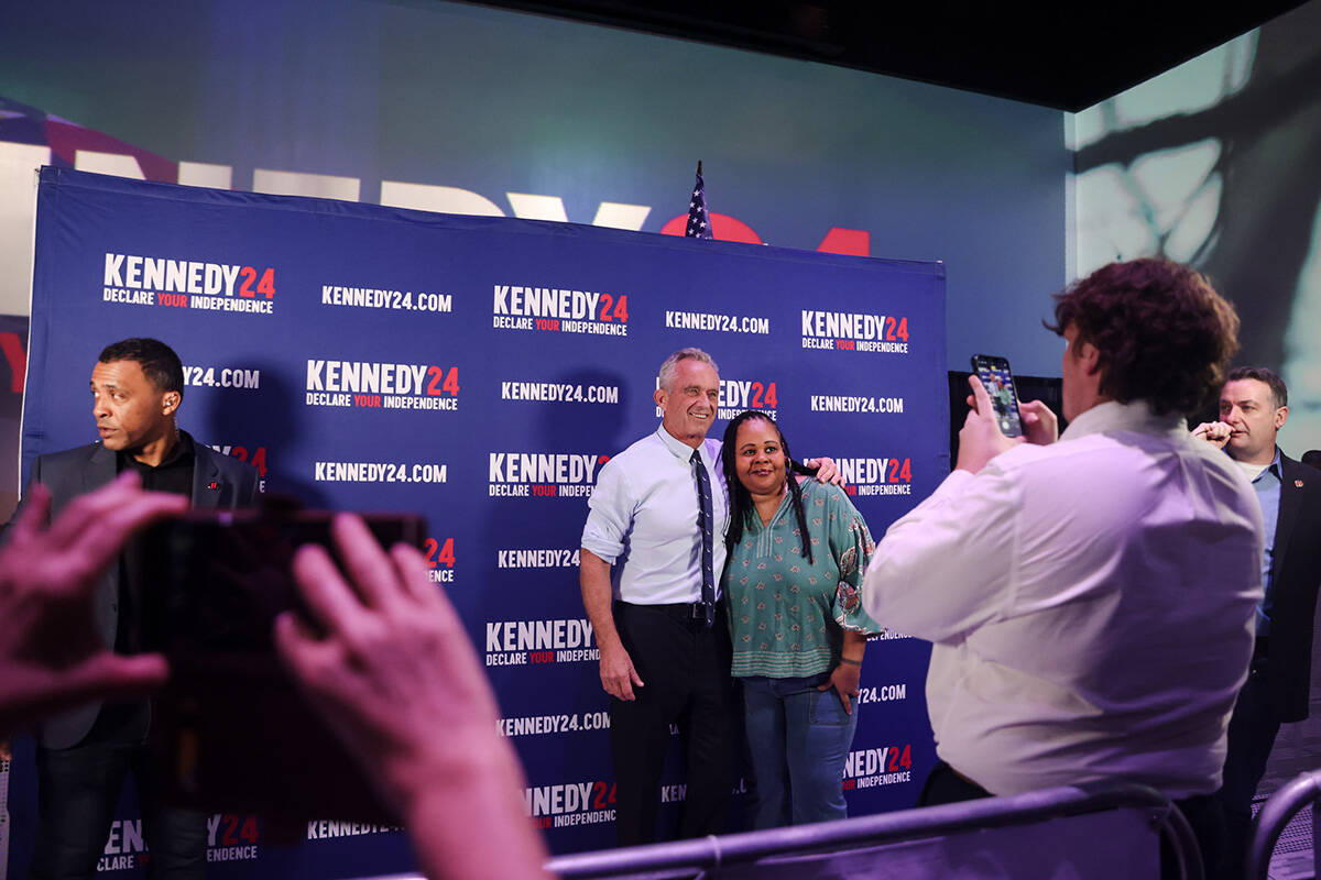 Independent presidential candidate Robert F. Kennedy takes a photo with a supporter during a ca ...