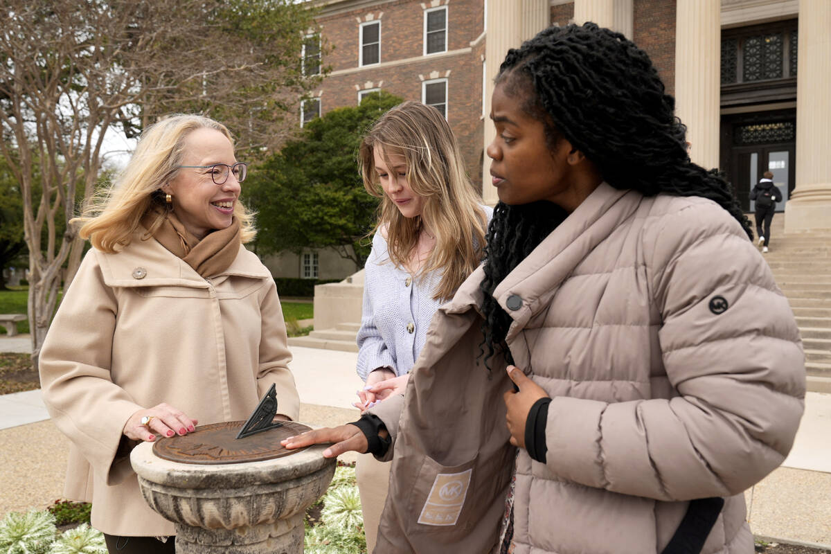 Alexis McCrossen, left, explains how a sun dial works to Hannah Spohn, center and Taylor Good, ...