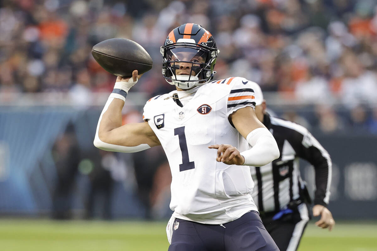 Chicago Bears quarterback Justin Fields (1) looks to pass the ball against the Arizona Cardinal ...