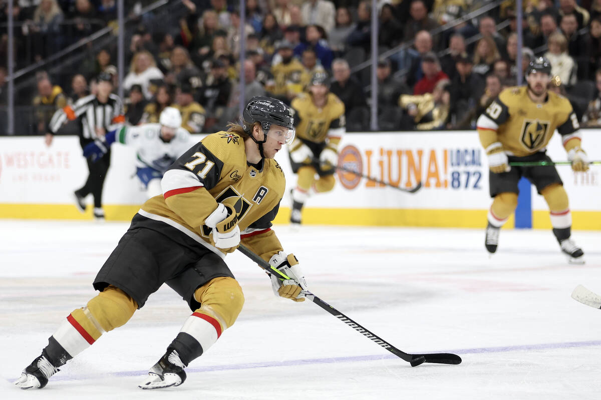 Golden Knights center William Karlsson (71) brings the puck up the ice during the first period ...