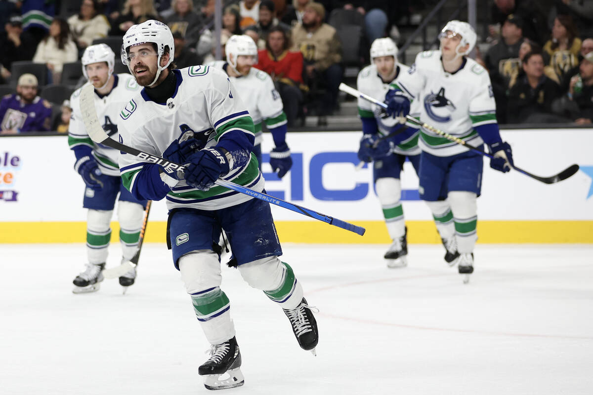 Canucks right wing Conor Garland (8) skates for the bench after scoring on the Golden Knights d ...