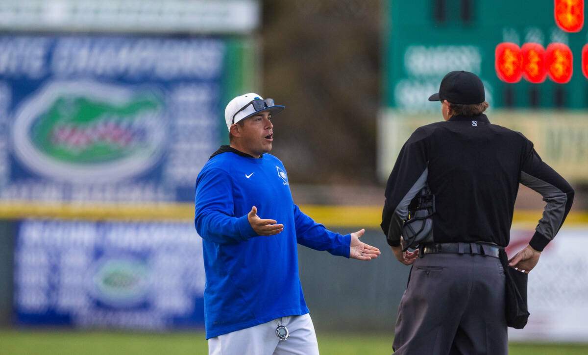 Green Valley coach argues a call with an umpire against Silverado during their NIAA baseball ga ...