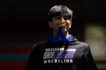 Silverado’s Zyon Trujillo poses for photos while accepting his medal for winning the 150 ...