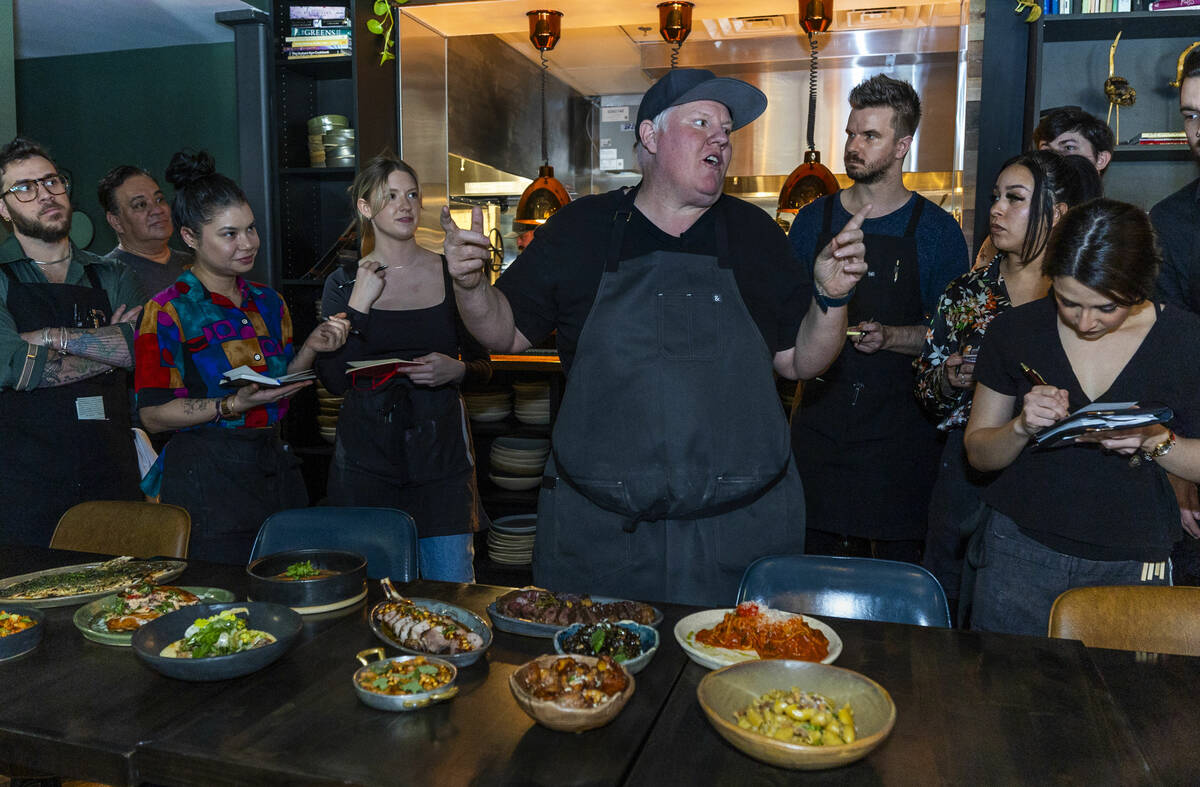 Esther's Kitchen chef/owner James Trees talks with his staff about each of their dishes and the ...