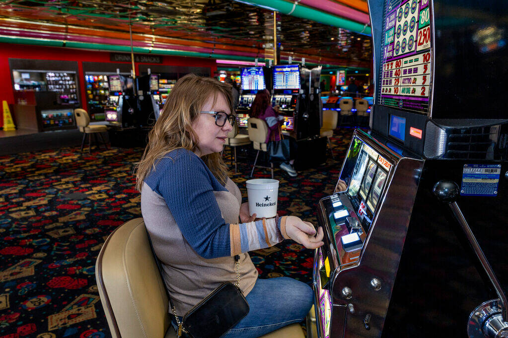 Jacy Pickens of South Carolina plays a quarter machine in Slots A Fun, the revamped slots area ...