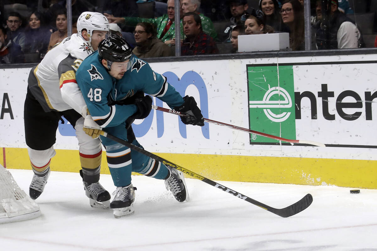 San Jose Sharks center Tomas Hertl (48) reaches for the puck in front of Vegas Golden Knights d ...