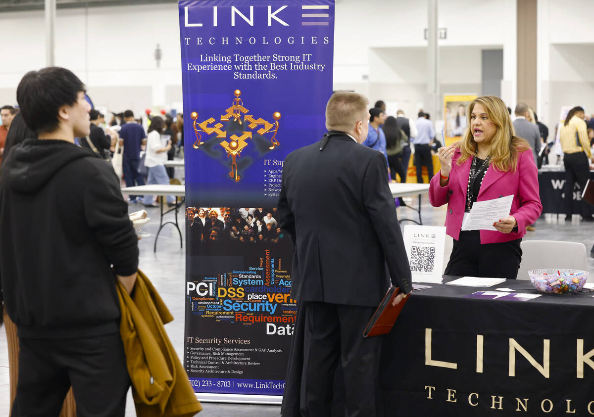 Ishana Lennard, right, a technical recruiter at Link Technologies, talks to a job seeker during ...
